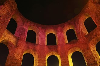 Ruins of Roman baths illuminated at night