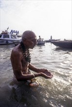 A pilgrim pays homage to the mother of Rivers Ganges in Varanasi