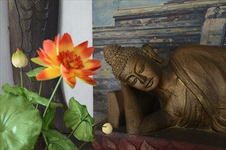 Reclining Buddha statue on an altar in a prayer room of the Brahma Vihara Buddhist monastery