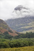 Mountain top of Bidean nam Bian and the famous Three Sisters of Glen Coe shrouded in mist