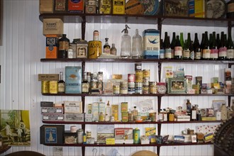Old-fashioned shop shelves with goods for sale