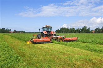 Mowing grass silage with Steyr tractor and Fella mower