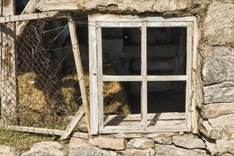 Broken window of a barn