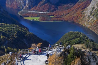 Tourists looking over the Koenigssee from the vantage point on the Jenner in autumn