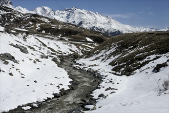 View of mountain river and snow