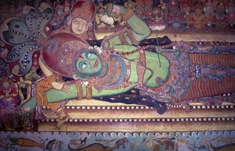 Vishnu sleeps on the coils of the celestial serpent Anantha. Murals in Siva temple in Ettumanoor
