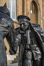 Statue by Andrew Edwards depicting British and German soldiers shaking hands during the Christmas truce in World War I in the market place of Messines