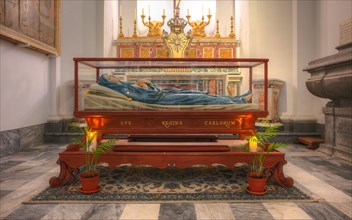 Interior view of Virgin Mary in glass coffin