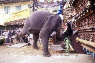 Elephant pushing the chariot in Radhotsavam or temple chariot festival in Kalpathy near Palakkad
