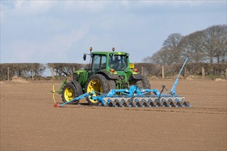 John Deere tractor with seed drill