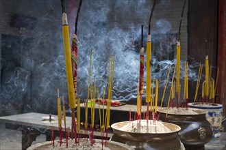Incense sticks burning on incense pot