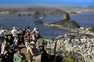 Tourists enjoying the view from Corcovado in Rio de Janeiro