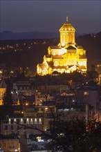 Overview of the Holy Trinity Cathedral and Tbilisi at dawn