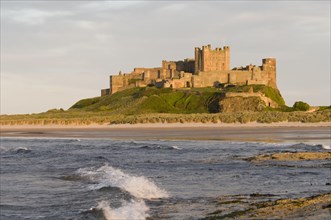 View across beach and sea towards castle
