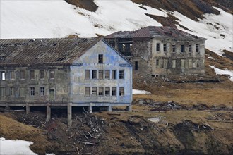 Dilapidated buildings of the abandoned Russian mining settlement in Svalbard