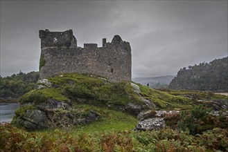 Castle Tioram on the tidal island Eilean Tioram in Loch Moidart in autumn