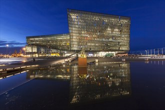 Harpa Concert Hall and Conference Centre illuminated at night in Reykjavik