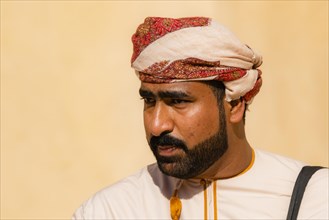 Man performing traditional songs during the Friday Goat Market in Nizwa