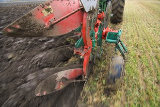 Close-up of a four-furrow reversible plough