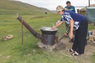 Kazakh nomads preparing noodles