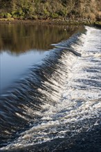 Weir and flood defence on river