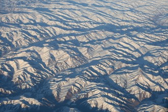 Aerial view of a snow-covered mountain range