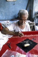 Old man making embroidery work in Thiruvallikeni or Triplicane in Chennai