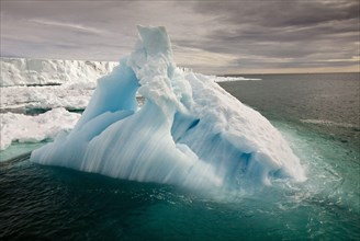 Iceberg in sea near coast