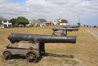 18th Century 18-pounder guns on seafront of seaside town