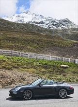 Porsche 911 997 4s convertible car at Timmelsjoch high alpine road