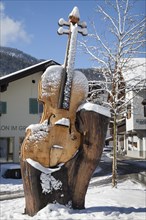 Wooden sculpture of a violin