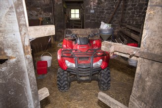 Honda quad bike in agricultural barn