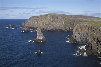 Rocky coastline with steep cliffs along the west coast of Fair Isle