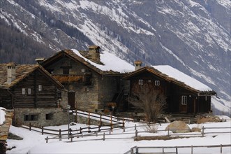 Alpine houses covered in snow
