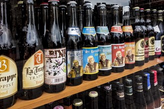 Belgian beers for sale in the window of a liquor shop in Belgium
