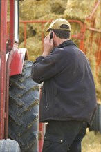 Farmer talking on mobile phone