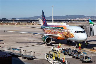 A Brussels Airlines Airbus A320 with registration OO-SNF in the Tomorrowland special livery at Barcelona Airport