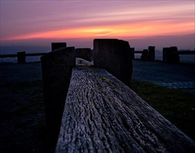 Wooden bench in the sunset on the Wallberg