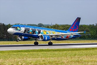An Airbus A320 aircraft of Brussels Airlines with registration number OO-SND and the Smurfs special livery at Brussels Airport