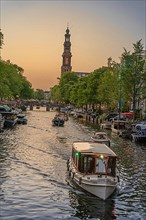 Boat cruising the canals at golden hour