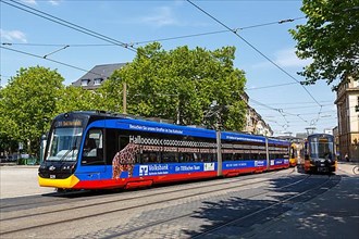 AVG Tram type Stadler CityLink local tram with advertising at the main station stop in Karlsruhe
