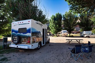 Motorhome with company logo on a campsite