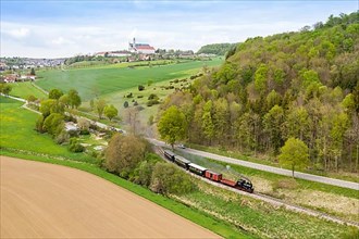Steam train of the Haertsfeld Museumsbahn Schaettere aerial view railway steam train with Neresheim monastery