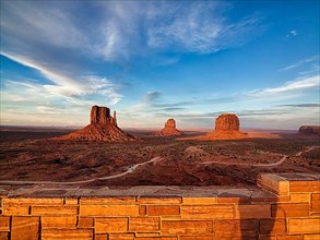 View of gravel road and mesas at sunset from the viewing platform