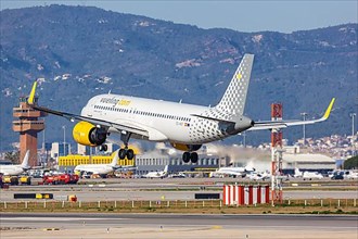 A Vueling Airbus A320neo with registration EC-NCF lands at Barcelona Airport