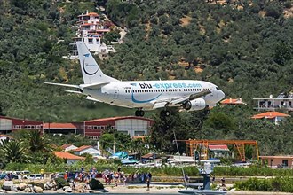 A Boeing 737-300 aircraft of Blu Express with registration number I-BPAM lands at Skiathos airport