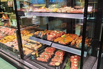 Refrigerated display case for prepared meat products