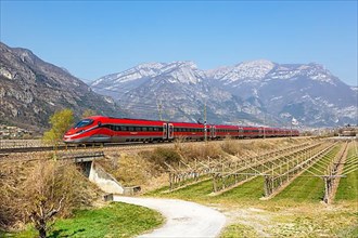 Frecciarossa FS ETR 1000 high-speed train of Trenitalia on the Brenner line near Avio
