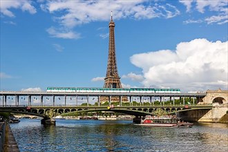 Paris Metro over the Seine with Eiffel Tower between Bir-Hakeim and Passy stops in Paris