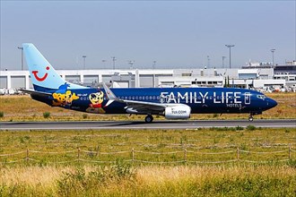A TUI Belgium Boeing 737-800 aircraft with registration number OO-JAF and Family Life Hotels special livery at Paris Orly Airport